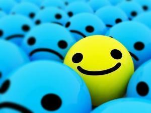 yellow smile in field of blue frowns